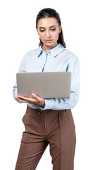 Wall Mural - Serious young woman using laptop, isolated