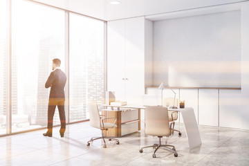 Wall Mural - Businessman in white panoramic CEO office