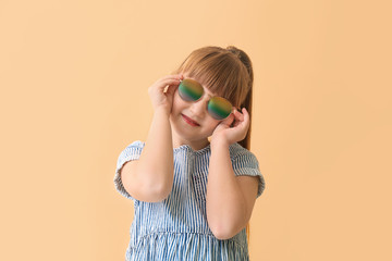 Sticker - Funny little girl with sunglasses on color background