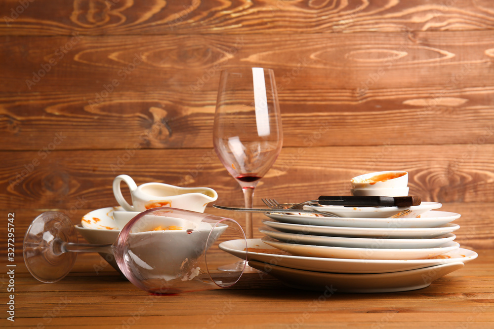 Dirty tableware on wooden background