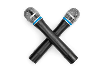 Two crossed microphone on a white background.