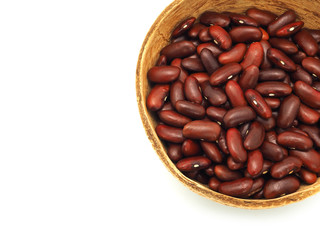 Red kidney beans in a coconut shell bowl, High protein. Top view with copy space. Close up.