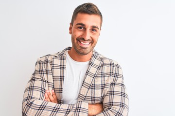 Wall Mural - Young handsome business man wearing elegant jacket over isolated background happy face smiling with crossed arms looking at the camera. Positive person.