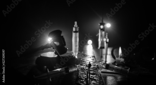 A crazed drug addict reaches for another dose of the drug in the syringe Tableau sur Toile