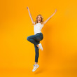 © Prostock-studio - Enjoying youth. Overjoyed girl fooling and jumping