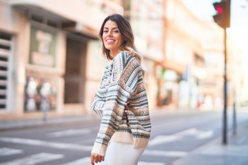 Wall Mural - Young beautiful woman smiling happy and confident. Standing and walking at town street