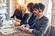 © Krakenimages.com - Group of call center workers smiling happy and confident. Working together with smile on face using headset at the office.