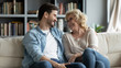 © fizkes - Overjoyed mature mother and adult son have fun at home