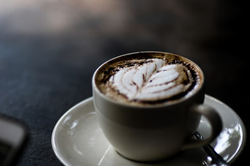 Latte coffee cup at coffee shop.