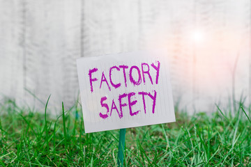 Poster - Text sign showing Factory Safety. Business photo showcasing minimize risk of worker injury while doing production tasks Plain empty paper attached to a stick and placed in the green grassy land