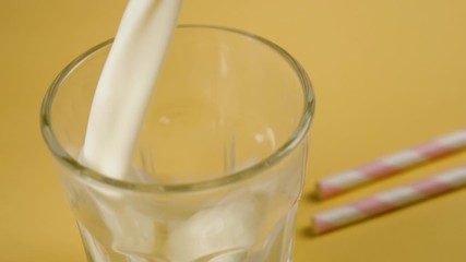 Poster - milk pouring in a glass- slow motion