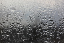 Raindrops On The Window On A Blurred Background Of Inclement Weather