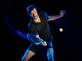 Paddle tennis player man light painting isolated black background