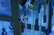 Hooks of a two-chain chain lanyard on the background of a production room.