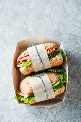 Takeaway sandwiches in paper box. Top view, copy space.