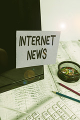 Poster - Handwriting text Internet News. Conceptual photo the information about current events published online Note paper taped to black computer screen near keyboard and stationary