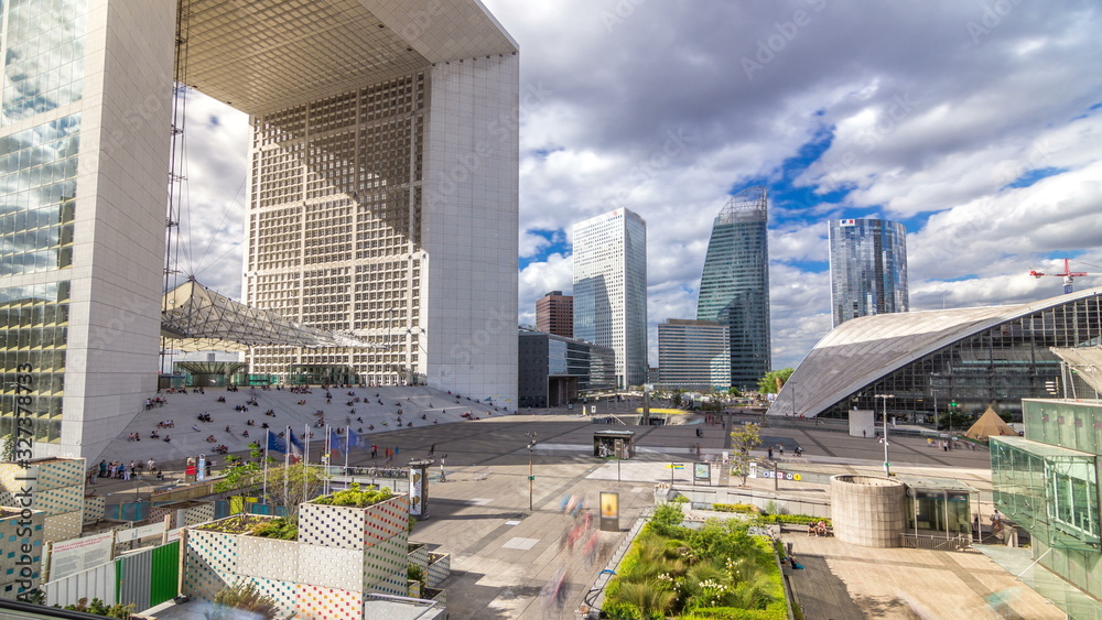 The Grande Arche and skyscrapers timelapse  in the Defence business district of Paris, France. - obrazy, fototapety, plakaty 