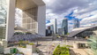 The Grande Arche and skyscrapers timelapse  in the Defence business district of Paris, France.