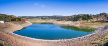 High Angle View Of Anderson Reservoir, A Man Made Lake In Morgan Hill, Managed By The Santa Clara Valley Water District, Maintained At Low Level Due To Failure Risk In Case Of Earthquake; California