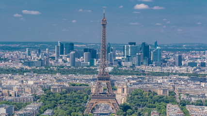 Poster - Aerial view from Montparnasse tower with Eiffel tower and La Defense district on background timelapse in Paris, France.