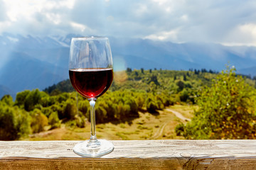 glass of wine in mountains