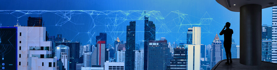 Poster - Businessman using mobbile phone with Smart city and wireless communication network new technology concept.