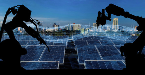 Leinwandbilder - Silhouette of modern automation robot arms with Ai assistant technology network concept and renewable power city building background.