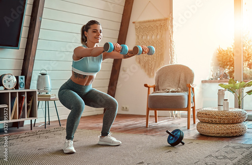 Fotomural Woman doing exercises at home.
