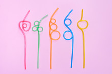 Top above overhead high angle view photo of five different colorful twisted in shapes cocktail straws isolated over pastel background
