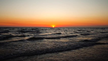 Wall Mural - Sunset over tropical beach beautiful nature scenery landscape in evening and sea wave of the sea. 