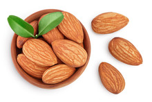 Almonds Nuts With Leaves In Wooden Bowl Isolated On White Background With Clipping Path And Full Depth Of Field. Top View. Flat Lay.