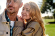 © Svitlana - Happy family. Close up portrait of beautiful romantic couple smiling and embracing while standing in the park