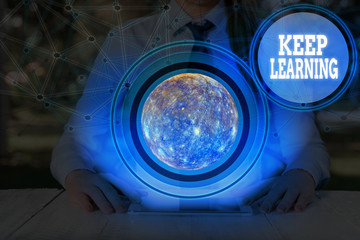 Wall Mural - Conceptual hand writing showing Keep Learning. Concept meaning Life long and selfmotivated pursuit of knowledge and ideas Elements of this image furnished by NASA