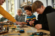 © Svitlana - Discover and Develop. Young technicians making toys at a technology class. Smart kids and STEM education.