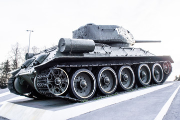 Monument to a military iron tracked tank with a gun. Minsk, Belarus - March 01 2020