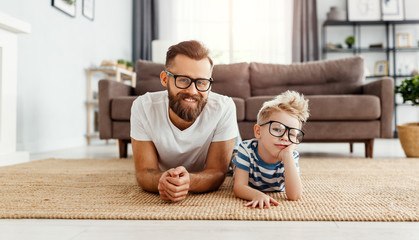 Wall Mural - father's day. happy funny family son and dad with glasses
