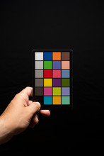 Photographer Holding A Photographic Colour Checker 