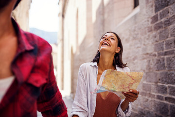 Wall Mural - Young happy woman with boyfriend at holiday