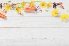 Flowers On White Wooden Background