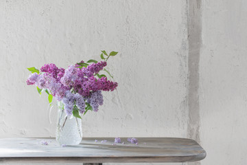 Wall Mural - bouquet of lilacs in a glass jug