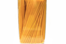 Italian Uncooked Pasta Spaghetti In Jar On White Background