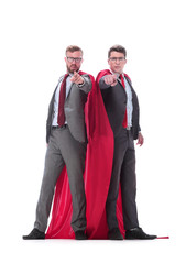 in full growth. two superhero businessman pointing at you