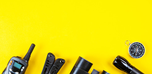 Wall Mural - A set of equipment for a hike or travel on a yellow background