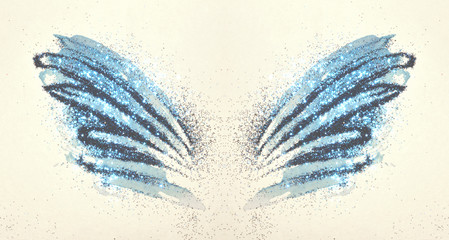 Blue glitter on abstract blue watercolor wings in vintage nostalgic colors.