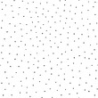 Black dots hand drawn vector background. Seamless pattern with randomly placed spots on white. Backdrop drawing irregular small polka dots. Monochrome design for fabric, home textiles, card, packaging
