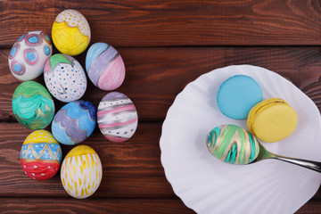 Wall Mural - painted handmade easter eggs on a wooden table background