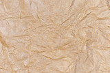 Fototapeta Desenie - Background of light brown crumpled wrapping paper, fragment, texture