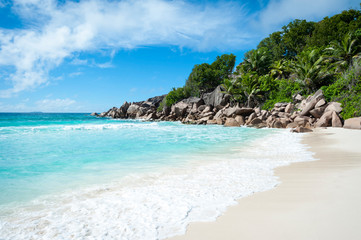 Wall Mural - bright empty landscape view of petite anse, a hidden beach on la digue island in the seychelles