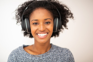 Wall Mural - front portrait african american smiling woman with headphones