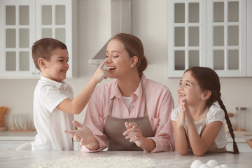 Canvas Print - Happy family cooking together in kitchen at home